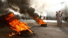 A Sudanese protester walks past burning tyres as military forces tried to disperse the sit-in outside Khartoum's army headquarters on June 3, 2019. AFP Photo A Sudanese protester walks past burning tyres as military forces tried to disperse the sit-in outside Khartoum's army headquarters on June 3, 2019. AFP Photo