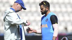 Indian team physiotherapist Patrick Farhart sprays the thumb of Virat Kohli after hurting it during a training session ahead of their Cricket World Cup match against South Africa at Ageas Bowl in Southampton, England on June 1, 2019. AP/PTI Photo Indian team physiotherapist Patrick Farhart sprays the thumb of Virat Kohli after hurting it during a training session ahead of their Cricket World Cup match against South Africa at Ageas Bowl in Southampton, England on June 1, 2019. AP/PTI Photo