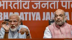 Prime Minister Narendra Modi speaks as BJP President Amit Shah looks on during a press conference at the party headquarter in New Delhi, on May 17, 2019. PTI Photo Prime Minister Narendra Modi speaks as BJP President Amit Shah looks on during a press conference at the party headquarter in New Delhi, on May 17, 2019. PTI Photo