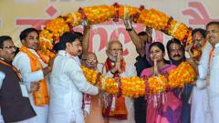Prime Minister Narendra Modi with NDA candidate for Mirzapur parliamentary seat Anupriya Patel (R) being garlanded during an election campaign rally for the ongoing Lok Sabha polls, in Mirzapur on May 16, 2019. PTI Photo Prime Minister Narendra Modi with NDA candidate for Mirzapur parliamentary seat Anupriya Patel (R) being garlanded during an election campaign rally for the ongoing Lok Sabha polls, in Mirzapur on May 16, 2019. PTI Photo