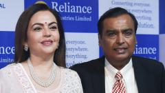 India's richest man and oil-to-telecom conglomerate Reliance Industries chairman Mukesh Ambani (R) along with his wife Nita Ambani (L) pose as they arrive for the company's 42nd AGM in Mumbai on Monday. India's richest man and oil-to-telecom conglomerate Reliance Industries chairman Mukesh Ambani (R) along with his wife Nita Ambani (L) pose as they arrive for the company's 42nd AGM in Mumbai on Monday.