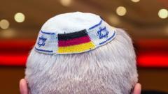 Picture taken on June 10, 2014 in Frankfurt am Main, Germany, shows a man wearing a Jewish kippa skullcap with the flags of Germany and Israel. dpa/AFP/Germany OUT Photo Picture taken on June 10, 2014 in Frankfurt am Main, Germany, shows a man wearing a Jewish kippa skullcap with the flags of Germany and Israel. dpa/AFP/Germany OUT Photo
