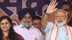 PM Narendra Modi waves at supporters as party's Sirsa Lok Sabha constituency candidate Sunita Duggal looks on during Vijay Sankalp rally ahead of general elections, in Fatehabad, on May 08, 2019. Photo: PTI PM Narendra Modi waves at supporters as party's Sirsa Lok Sabha constituency candidate Sunita Duggal looks on during Vijay Sankalp rally ahead of general elections, in Fatehabad, on May 08, 2019. Photo: PTI