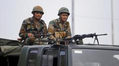 Army personnel stand guard during restrictions, at Bikram Chowk in Jammu, Monday. Army personnel stand guard during restrictions, at Bikram Chowk in Jammu, Monday.